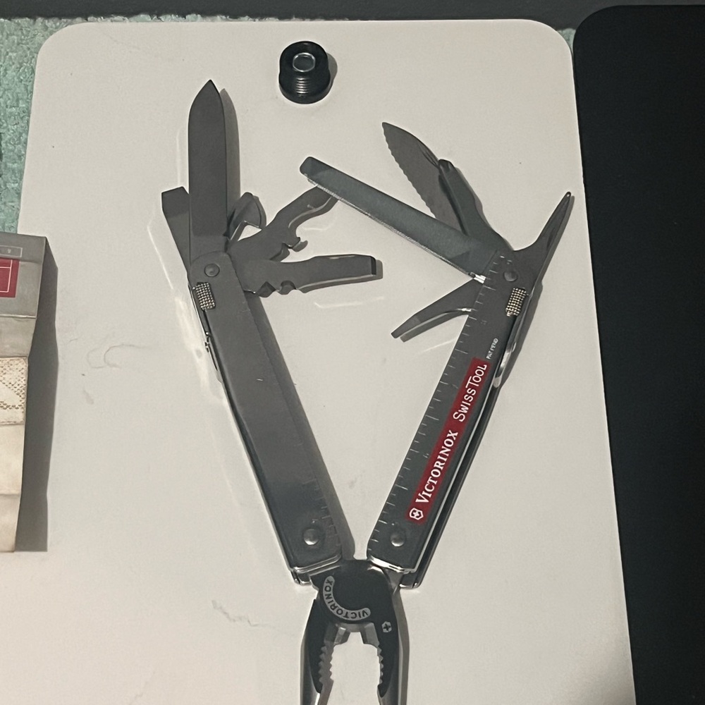Victorinox SwissTool in Red and Silver. SOLD SOLD UPDATE
